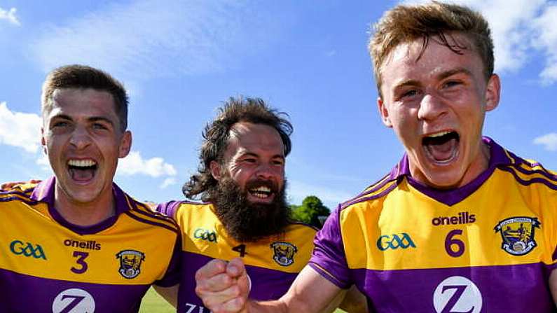 27 June 2021; Wexford players, from left, Gavin Sheehan, Conor Carthy and Martin O'Connor celebrate after their side's victory in the Leinster GAA Football Senior Championship Round 1 match between Wicklow and Wexford at County Grounds in Aughrim, Wicklow. Photo by Piaras O Midheach/Sportsfile