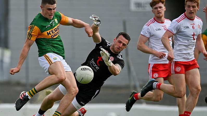 12 June 2021; Sean O'Shea of Kerry kicks a point despite the efforts of Tyrone goalkeeper Niall Morgan  during the Allianz Football League Division 1 semi-final match between Kerry and Tyrone at Fitzgerald Stadium in Killarney, Kerry. Photo by Brendan Moran/Sportsfile