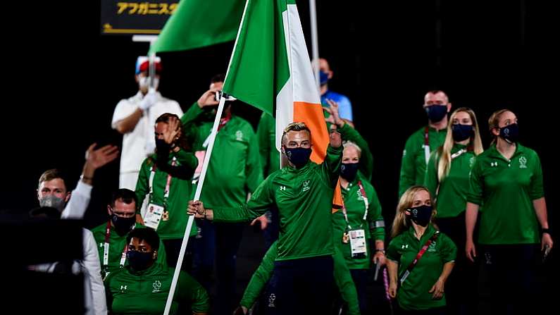 24 August 2021; Ireland flagbearers Jordan Lee, right, and Britney Arendse carry the Irish tri-colour during the Opening Ceremony of the Tokyo 2020 Paralympic Games at the Olympic Stadium in Tokyo, Japan. Photo by Sam Barnes/Sportsfile