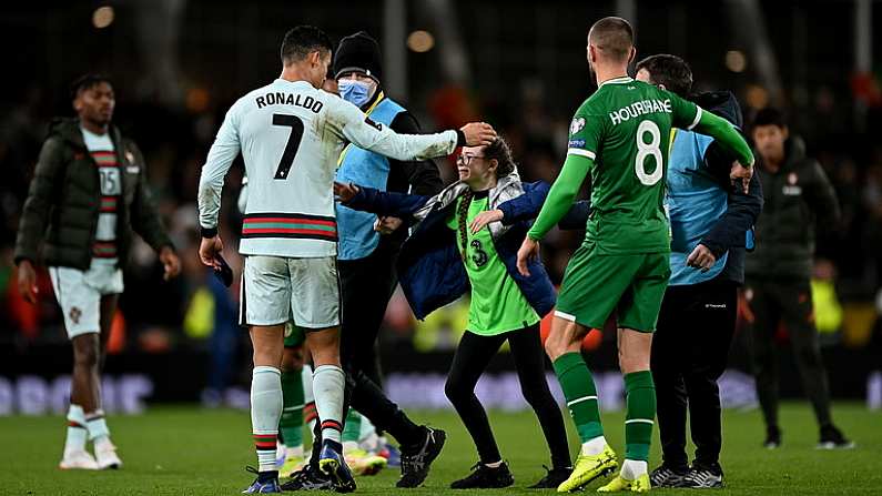 11 November 2021; Republic of Ireland supporter, Addison Whelan, is greeted by Cristiano Ronaldo of Portugal before getting his jersey after the final whistle of the FIFA World Cup 2022 qualifying group A match between Republic of Ireland and Portugal at the Aviva Stadium in Dublin. Photo by Seb Daly/Sportsfile