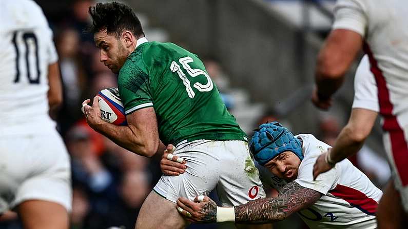 12 March 2022; Hugo Keenan of Ireland gets past the tackle of Jack Nowell of England on his way to scoring his side's second try during the Guinness Six Nations Rugby Championship match between England and Ireland at Twickenham Stadium in London, England. Photo by David Fitzgerald/Sportsfile