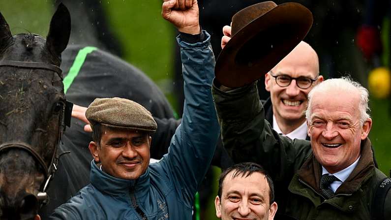 16 March 2022; Groom Imran Haider, left, owner Tony Bloom and trainer Willie Mullins, right, celebrate after winning the Betway Queen Mother Champion Chase with Energumene on day two of the Cheltenham Racing Festival at Prestbury Park in Cheltenham, England. Photo by Seb Daly/Sportsfile