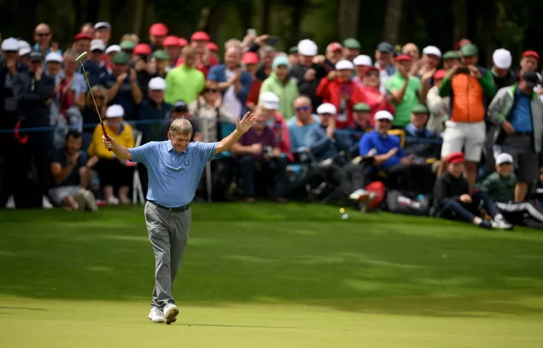 Former footballer and manager Kenny Dalglish celebrates a birdie putt during day two of the JP McManus Pro-Am at Adare Manor Golf Club