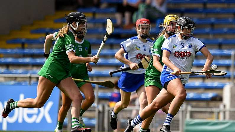 16 July 2022; Abby Flynn of Waterford in action against Rebecca Delee, left, and Stephanie Woulfe of Limerick during the Glen Dimplex All-Ireland Senior Camogie Quarter Final match between Waterford and Limerick at Semple Stadium in Thurles, Tipperary. Photo by George Tewkesbury/Sportsfile