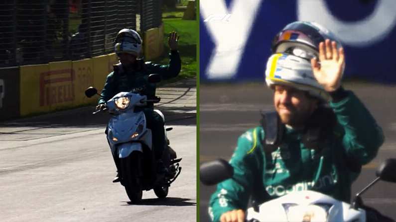 Sebastian Vettel rides a scooter at the Australian Grand Prix