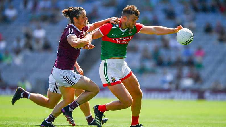 25 July 2021; Aidan O'Shea of Mayo is tackled by Kieran Molloy of Galway during the Connacht GAA Senior Football Championship Final match between Galway and Mayo at Croke Park in Dublin. Photo by Ray McManus/Sportsfile