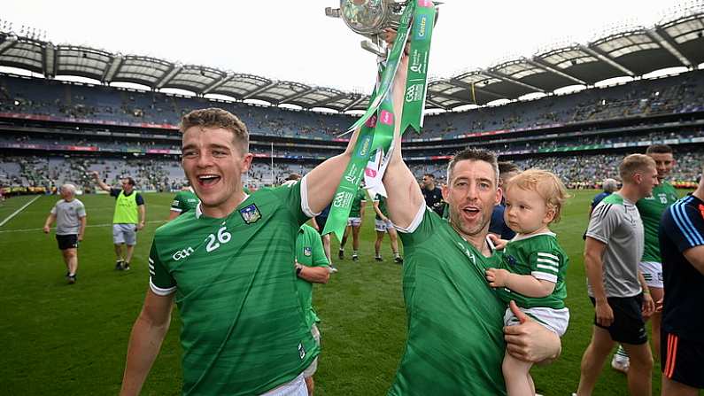 17 July 2022; Limerick's David Reidy, left, and Graeme Mulcahy with his one-year-old daughter Roise celebrate with the Liam MacCarthy Cup after the GAA Hurling All-Ireland Senior Championship Final match between Kilkenny and Limerick at Croke Park in Dublin. Photo by Stephen McCarthy/Sportsfile