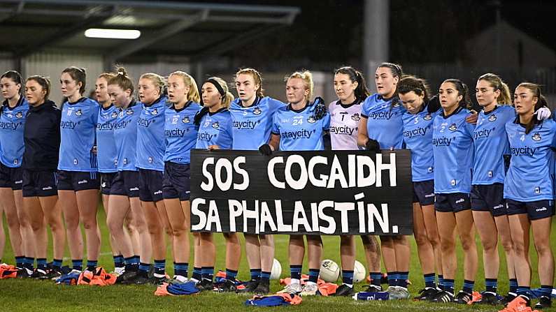 20 January 2024; Dublin players hold a banner in solidarity with Palestine during the national anthem before the 2024 Lidl Ladies National Football League Division 1 Round 1 fixture between Dublin and Kerry at Parnell Park in Dublin. Photo by Sam Barnes/Sportsfile