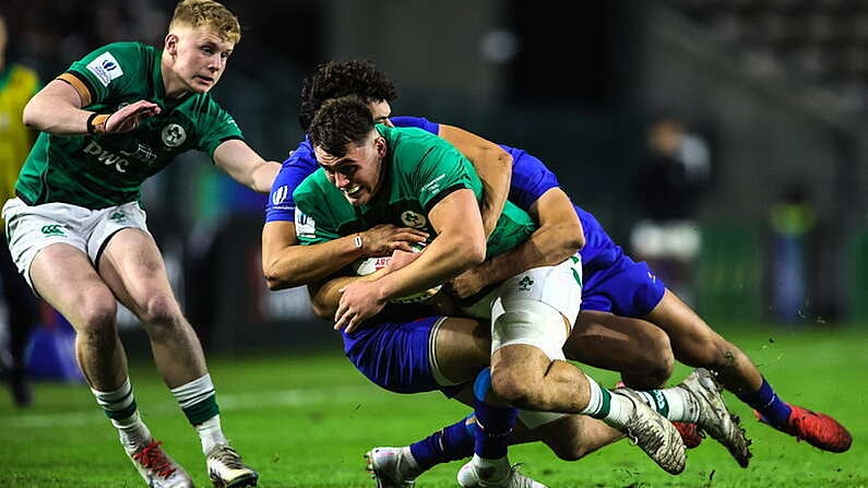 14 July 2023; Brian Gleeson of Ireland is tackled by Leo Drouet and Nicolas Depoortere of France during the U20 Rugby World Cup Final between Ireland and France at Athlone Sports Stadium in Cape Town, South Africa. Photo by Shaun Roy/Sportsfile