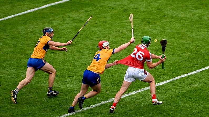 21 July 2024; Robbie O'Flynn of Cork takes a shot despite the challenge of Conor Leen of Clare which subsequently went wide near the end of the GAA Hurling All-Ireland Senior Championship Final between Clare and Cork at Croke Park in Dublin. Photo by Daire Brennan/Sportsfile