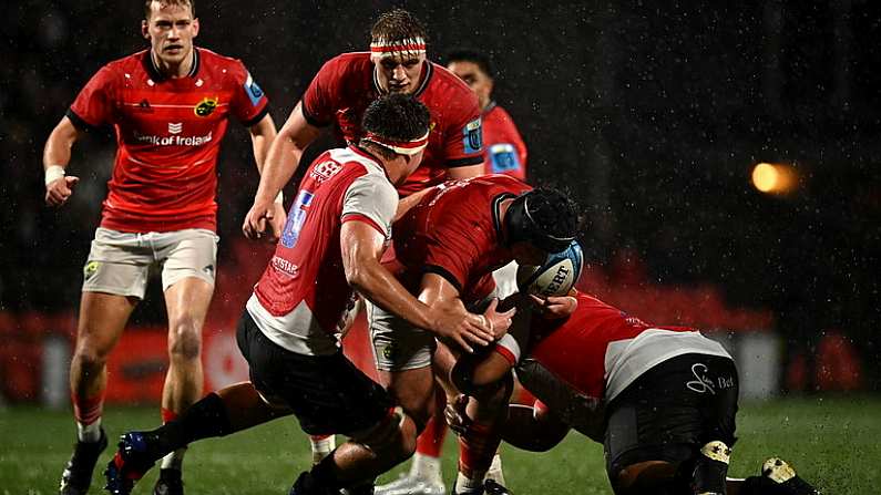 6 January 2023; Josh Wycherley of Munster is tackled by Jarod Cairns, left, and Asenathi Ntlabakanye of Emirates Lions during the United Rugby Championship between Munster and Emirates Lions at Musgrave Park in Cork.  Photo by Eoin Noonan/Sportsfile Photo by Eoin Noonan/Sportsfile