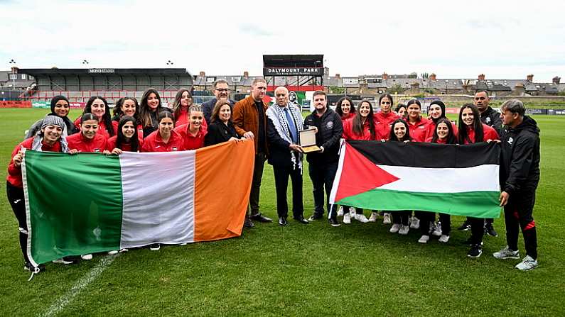 14 May 2024; Jibril Rajoub, president of the Palestinian Football Association and chair of the Palestinian Olympic Committee, makes a presentation to Daniel Lambert, chief operating officer, Bohemian Football Club, left, and Luke O'Riordan, communications officer, Bohemian Football Club, right, during a photocall ahead of the International Solidarity Match between Bohemians women's team and Palestine women's team to be played on Wednesday, May 15, at Dalymount Park in Dublin. Photo by Stephen McCarthy/Sportsfile