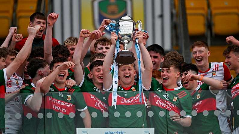 24 May 2024; Mayo captain David Hurley lifts the The Tom Kilcoyne Cup after the Connacht GAA Football Minor Championship final match between Mayo and Roscommon at Dr Hyde Park in Roscommon. Photo by Stephen Marken/Sportsfile