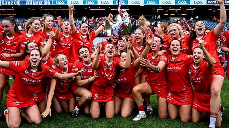 11 August 2024; Laura Hayes, centre, celebrates with the O'Duffy Cup alongside her team-mates after their side's victory in the Glen Dimplex Camogie All-Ireland Senior Camogie Championship final between Cork and Galway at Croke Park in Dublin. Photo by Piaras O Midheach/Sportsfile