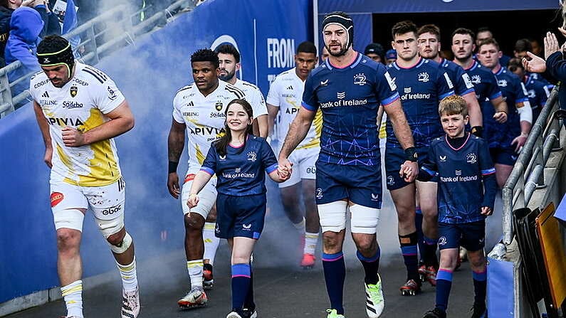 13 April 2024; Leinster captain Caelan Doris walks out with Matchday mascots Avery Tuite and Daragh De Burca before the Investec Champions Cup quarter-final match between Leinster and La Rochelle at the Aviva Stadium in Dublin. Photo by Harry Murphy/Sportsfile