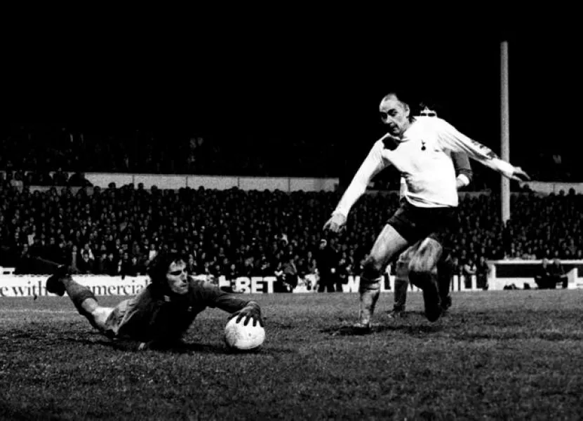 Ray Clemence dives at the feet of Tottenham’s Alan Gilzean 