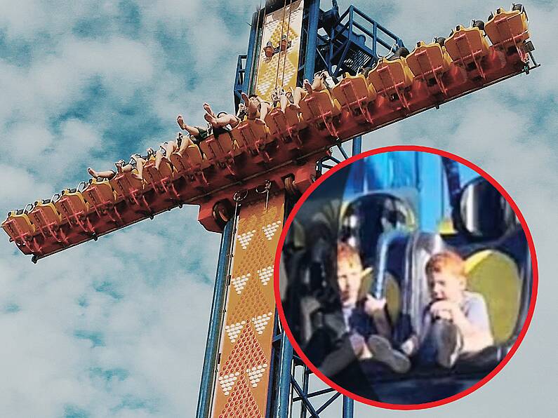 Mother watches in horror as unrestrained son clings to 'Free Fall' ride