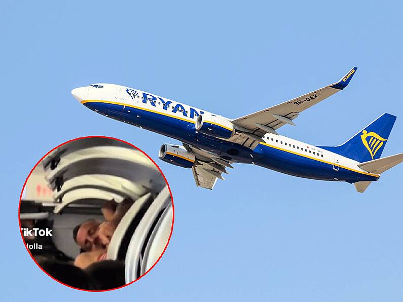 Watch: Absolute eejit wakes up on Ryanair flight inside overhead luggage locker