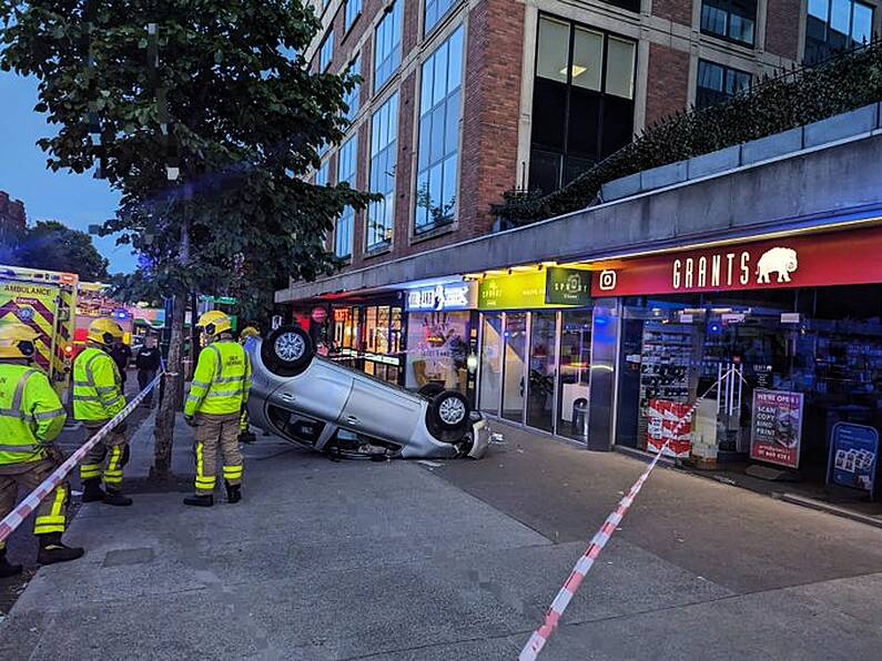 Car falls out of car park and onto footpath