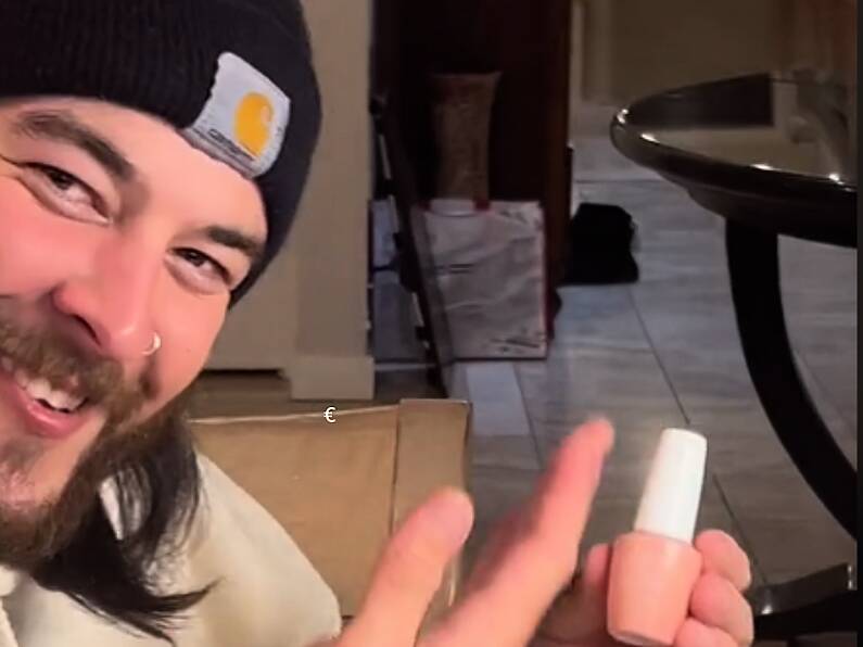 Boyfriend learns how to apply gel nails to save his girlfriend money