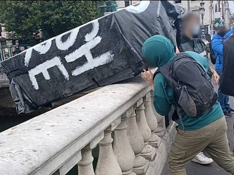 Coffin marked 'RIP British Empire' thrown into Liffey during anti-monarchy march