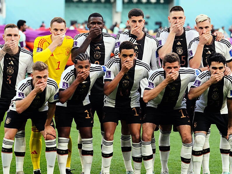 German players cover mouths for team photo in protest over OneLove armband ban