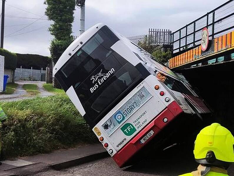 Double-decker bus crashes into railway bridge