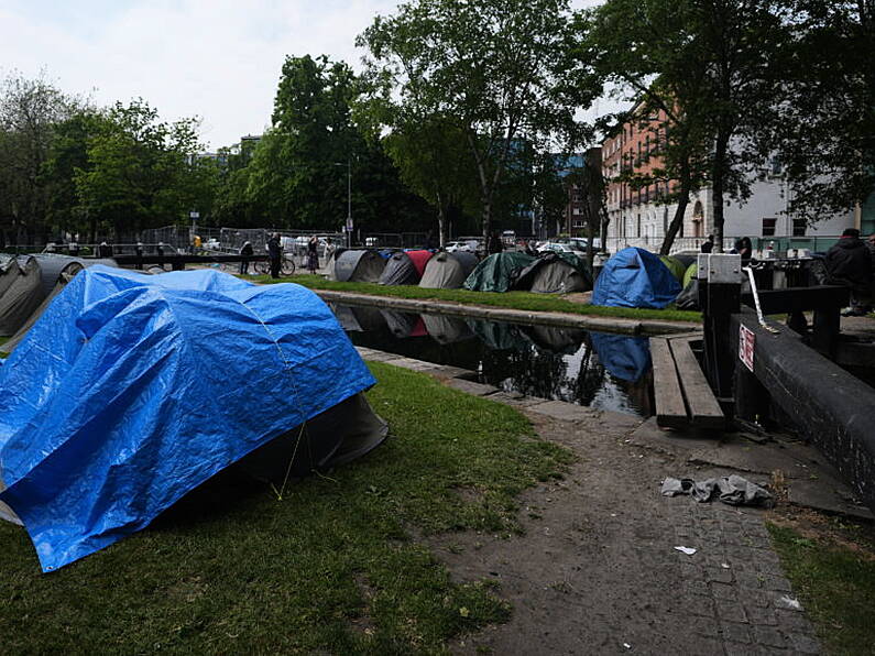 Asylum seeker tents not removed because of Europa League final, insists minister