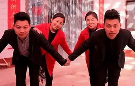 Pic shows: The two identical couples.nnA pair of identical twin brothers in China who married identical twin sisters are to have minor cosmetic surgery in order to help with their awkward identification problems.nnThe decision comes after friends and family had constantly complained about not being able to tell them apart before, during, and after their wedding.nnBut the issue reached a worrying point when one brother found himself holding the hand of his sister-in-law one night after dinner.nnZhao Xin and younger brother Zhao Xun, from a village in Yuncheng City, in North China¿s Shanxi Province, had been causing headaches for their relatives ever since they started dating sisters Yun Fei and Yun Yang, from a village 10 kilometres (6 miles) away.nnEven on their wedding day during the past Chinese New Year, the couples and their parents had to double-check several times to ensure they were not marrying the wrong partner.nnThe two pairs of identical siblings, aged 22, are said to be so alike that it is not even possible to tell them apart by their voices.nnWhile plastic surgery is still largely taboo in conservative Chinese societies, the couples and their relatives believe a minor adjustment would do them a world of good.nnThey are especially keen to avoid awkward situations similar to that which occurred earlier this year, when one newlywed husband apparently ended up holding the hand of his brother¿s wife during an evening stroll after dinner.nnReports said a hospital in China¿s eastern city of Shanghai has agreed to take on the couple¿s case, and will make small adjustments to their appearance so they can distinguish each other more easily.nn(ends)n