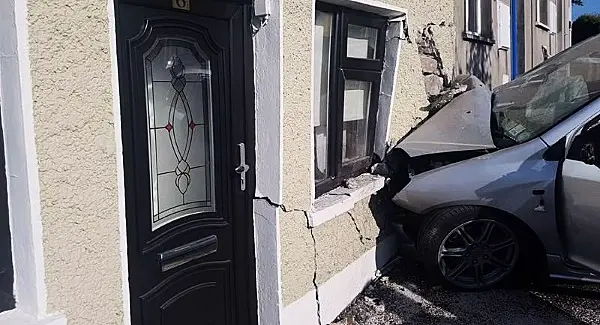 No serious injury in freak car crash that leaves house at risk of collapse