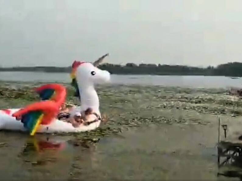 Police rescue a group of women stranded on a floating rainbow unicorn