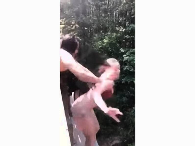 VIDEO: Shocking moment teenage girl pushed from a bridge caught on camera