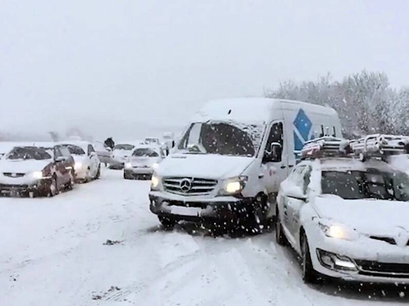 Around 100 cars left stranded in the snow in England