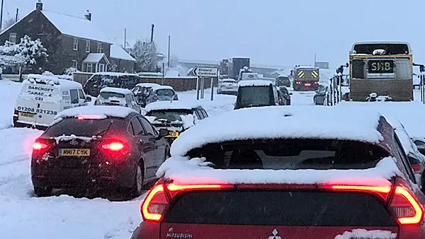 Around 100 cars left stranded in the snow in England