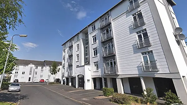 Latest: Flowers arrive at scene of triple death in Newry flat