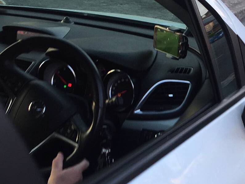 Driver faces €2,000 fine after been caught watching last night's Liverpool match while driving