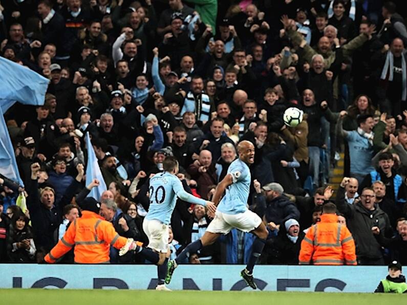 Vincent Kompany screamer sends Man City back to the top