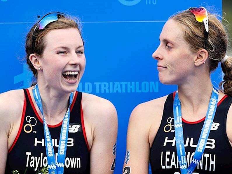 Triathletes disqualified from Olympic qualifier for crossing finish line hand-in-hand