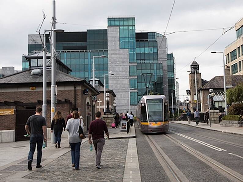 Two people injured in crash between Luas and car