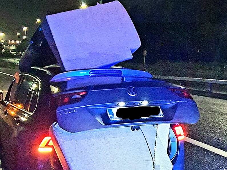 Gardaí stop reckless motorist who daringly transported couch on car roof