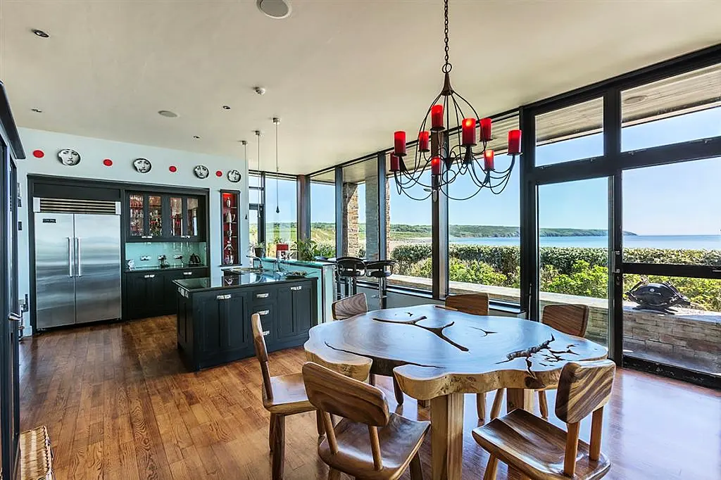 Pool at eye level with the ocean is this Irish coastal home's claim to fame