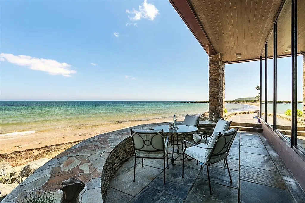 Pool at eye level with the ocean is this Irish coastal home's claim to fame