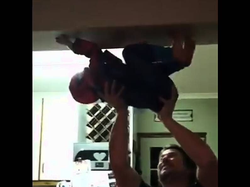 WATCH: Dad helps child pretend to be Spider-Man