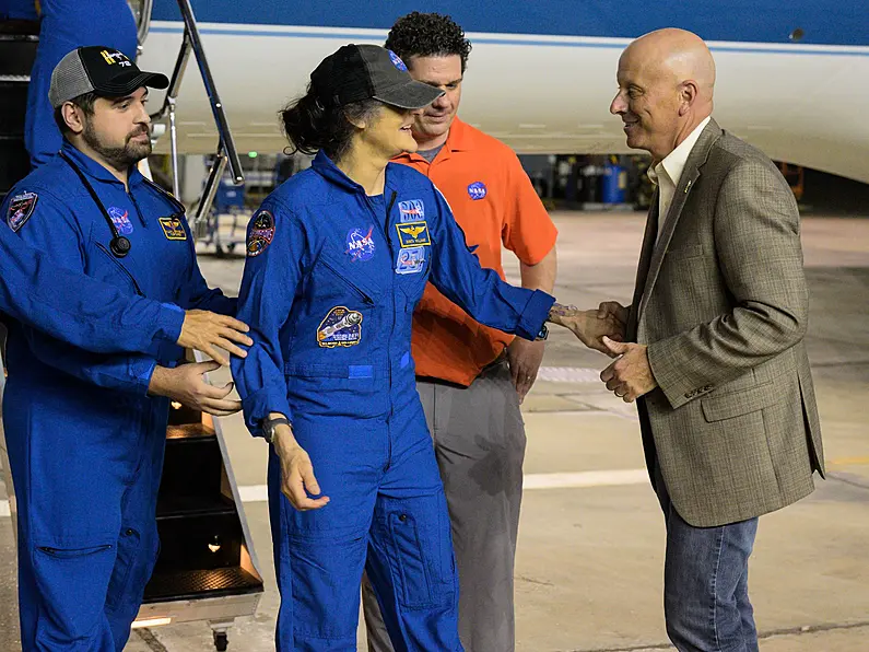 Astronauts stranded in space for nine months arrive back to Earth
