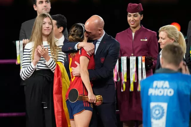 Luis Rubiales hugs a player