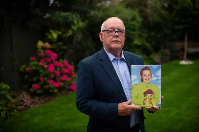 Michael O’Hare holding a photograph of his sister Majella