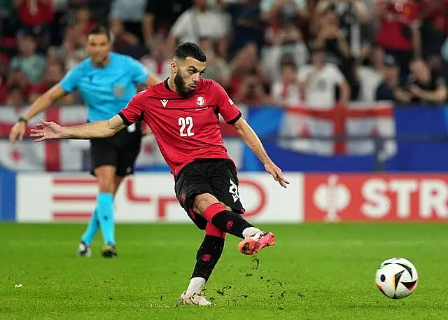 Georgia’s Georges Mikautadze scores their side’s second goal of the game