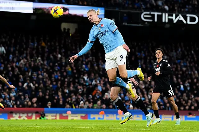 Manchester City's Erling Haaland scores a header