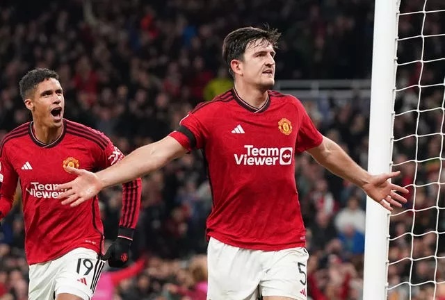 Harry Maguire, left, and Raphael Varane celebrate Maguire's winner against FC Copenhagen at Old Trafford