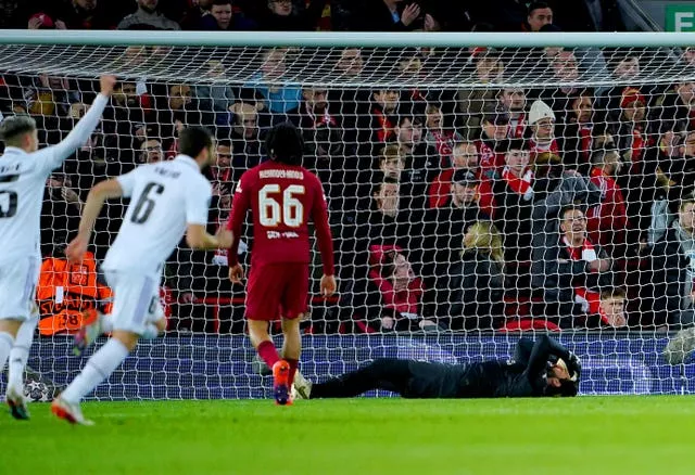 Liverpool goalkeeper Alisson Becker, right, reacts after Real Madrid’s fourth goal